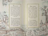 an open book with a picture of animals in it