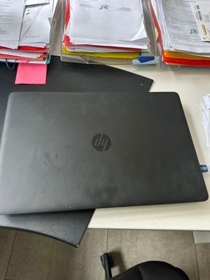 a laptop computer sitting on top of a desk next to a mouse