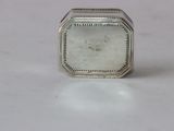 sterling silver ring with a white stone in the middle of it