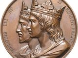 Sur la médaille, les deux hommes portent une couronne sur la tête.