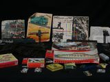 many different types of toy trains on a table