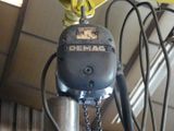 a close up of a crane with a chain attached to it ' s head