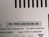 a close up of a silver electronic device on a table