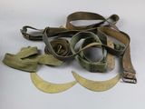a pair of glasses and a pair of belt on a table
