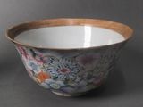 a bowl with a floral design on it sitting on a table