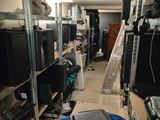 a room with a lot of computer equipment in it