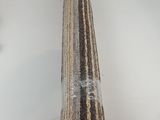 a close up of a piece of carpet on a white surface