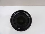 an image of a close up of a camera lens on a white surface