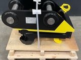 une photo d'une machine noire et jaune posée sur une palette