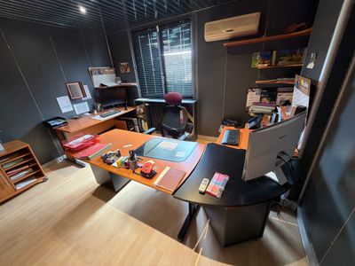 a room with a desk and a chair in it
