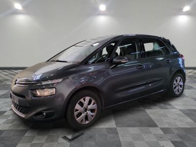 the grey citrole is parked in the garage on a checkered floor