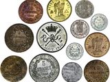 a close up of a bunch of coins on a white surface