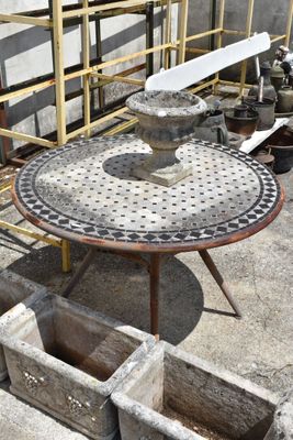 a table that is sitting on top of a cement slab