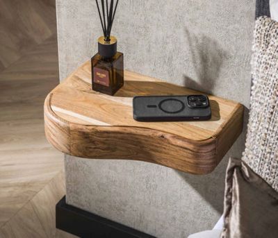 a wooden shelf with a remote control on top of it
