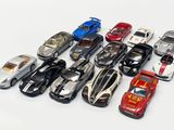 a lot of toy cars that are on a white surface