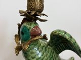 a bird that is sitting on top of a vase