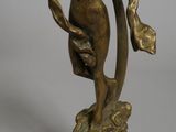 bronze statue of a woman holding a fan on a wooden base