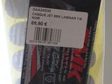 a plastic bag with a label on it and a pair of scissors in it