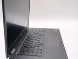 a laptop that is open on a white surface
