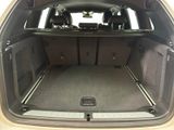 a trunk of a car with the back seats folded down