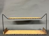 two tiered shelf with two shelves on each side and one shelf on the other