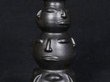 an image of a black vase sitting on top of a black table