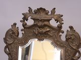 a mirror that is sitting on top of a table