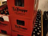 boxes of beer are stacked on top of each other in a room