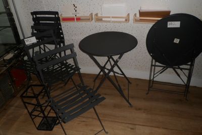 two chairs and a table in the corner of a room