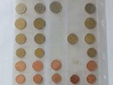 a lot of coins in a plastic bag on a table