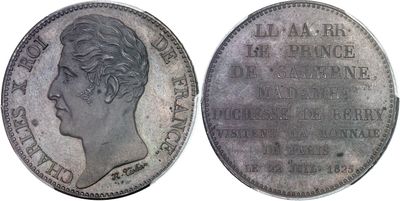 a close up of a coin with a woman ' s face on it