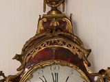 a clock that is hanging on the wall in the room