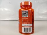 a bottle of orange pills sitting on a counter