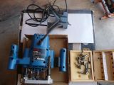 a blue machine that is sitting in a box