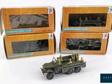 three boxed boxes of toy army vehicles with military figures in them