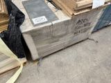 a pile of wood on a pallet in a warehouse