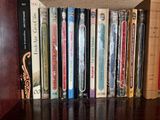 many books that are on a shelf in a book case