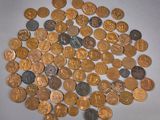 a lot of coins that are on the table