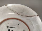 a close up of a plate with writing on it