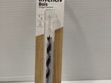 a black and white toothbrush in a package