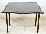 an image of a dining table with a leather top