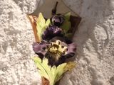 a piece of bread with a purple flower on it