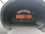a car dashboard with a speedometer on it