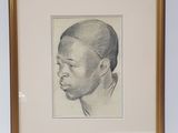 framed drawing of a young boy ' s head in a gold frame