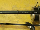 a close up of a fishing rod and reel on a table