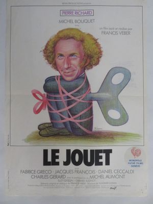 Affiche française du film « Le Jouet », représentant un dessin d'un homme tenant une clé géante