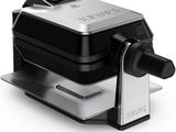 an image of a black and silver food processor on a white background