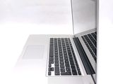 two laptops sitting side by side on a white surface