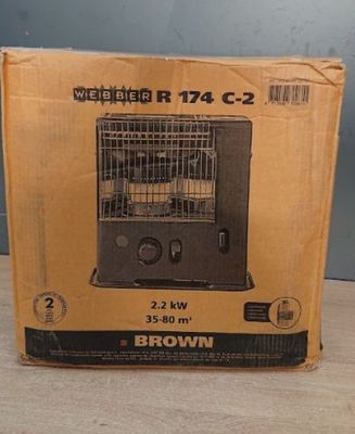 brown box with a bird inside of it sitting on a table