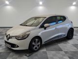 the white car is parked on a checkered tile floor
